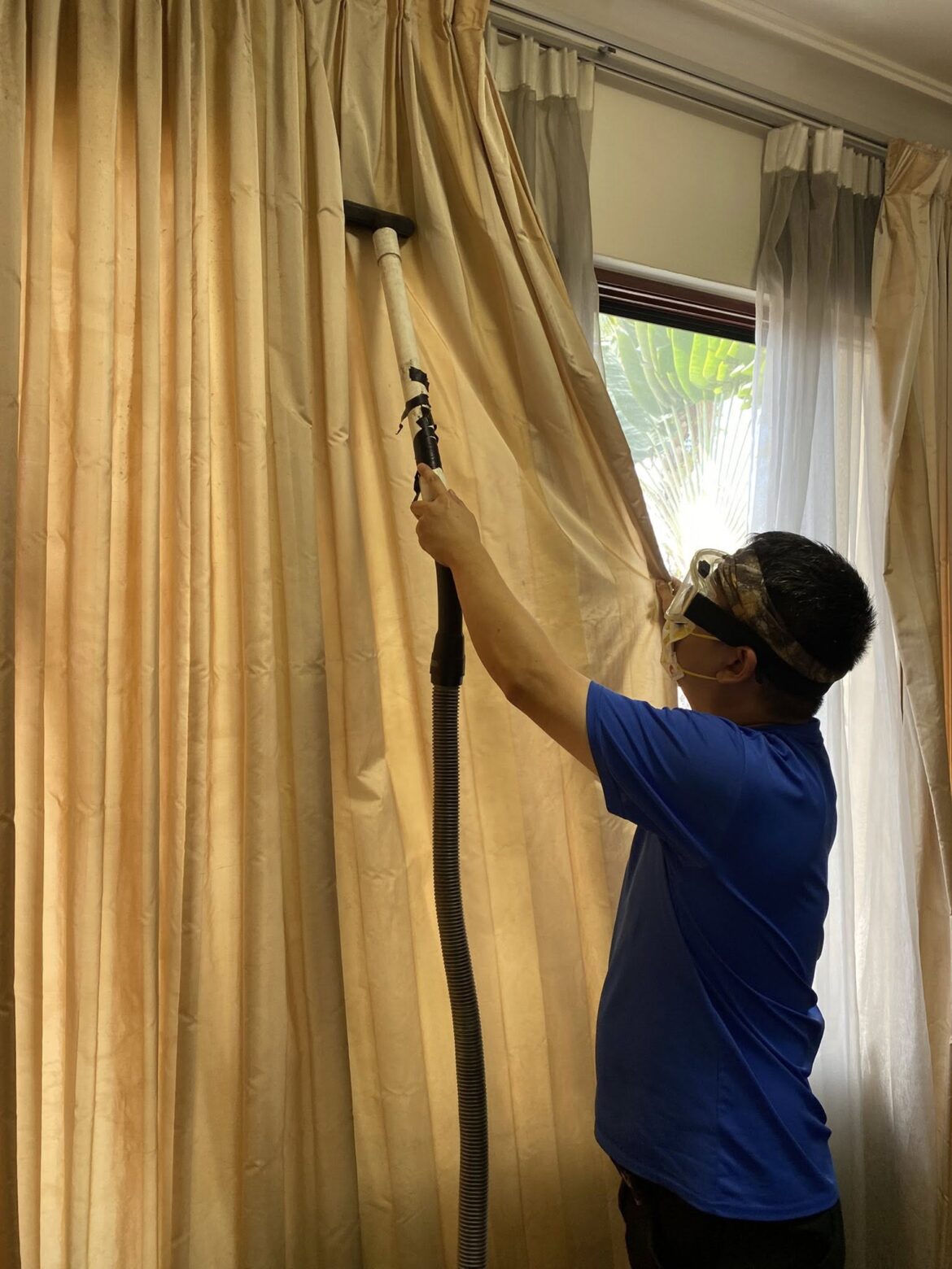 HovenClean technician cleaning curtains for curtain cleaning service near me in KL and Selangor