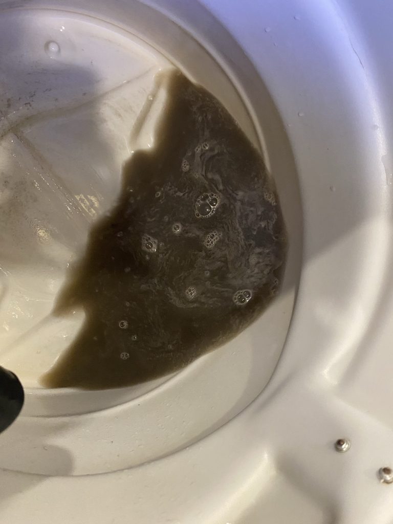 Dirty water extracted during sofa cleaning in Klang